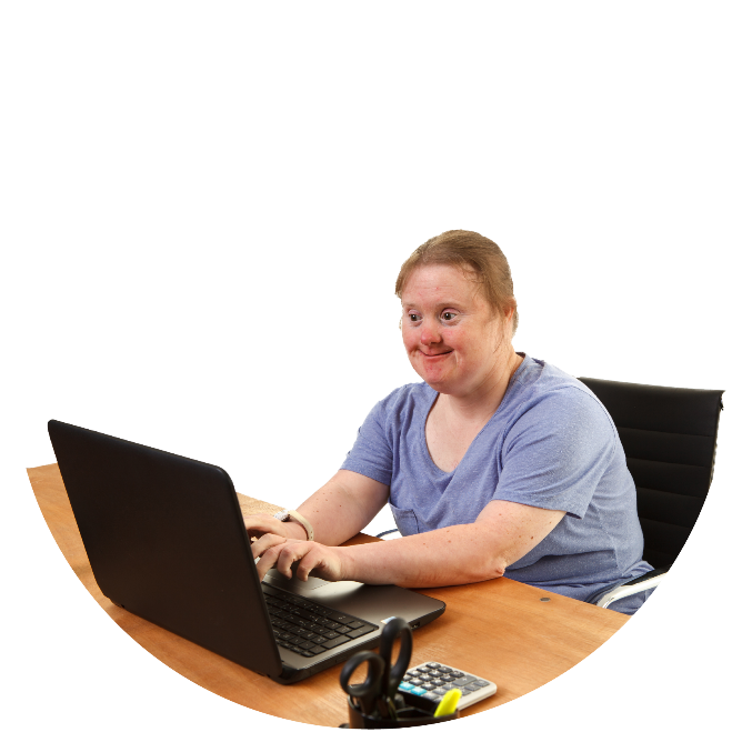 A person sitting at a desk with a computer